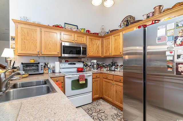 kitchen with sink and appliances with stainless steel finishes