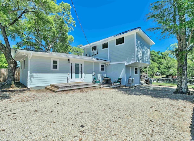 back of house featuring french doors