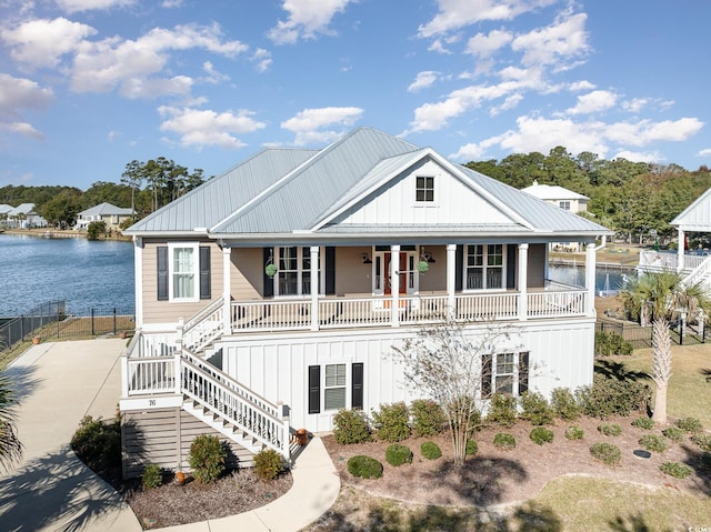 view of front of home with a water view and a porch