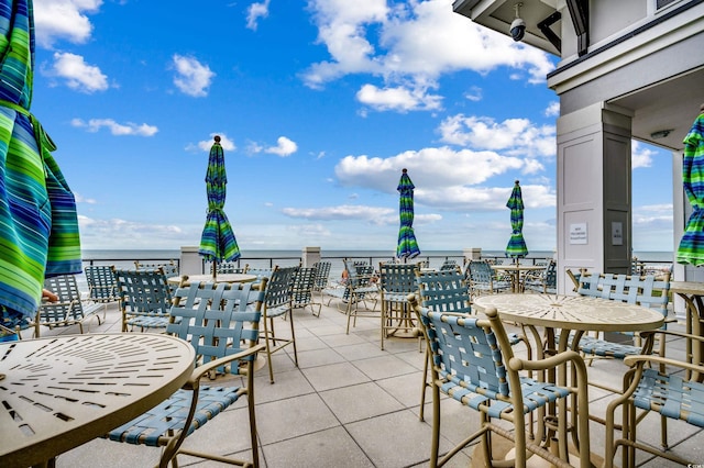 view of patio featuring a water view