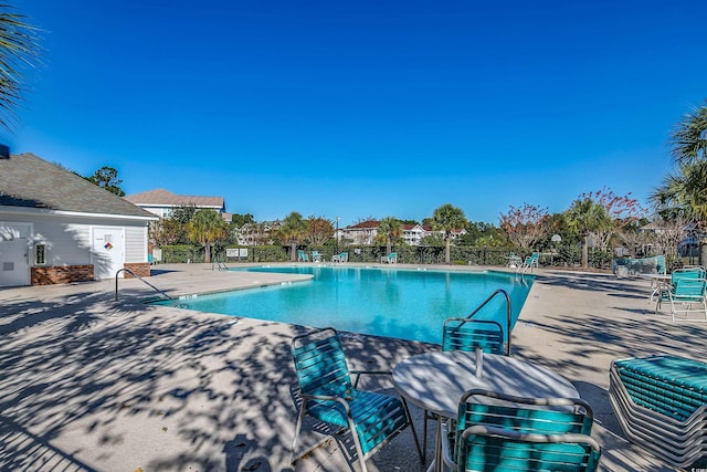 view of swimming pool with a patio