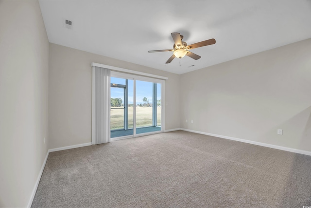 spare room with ceiling fan and carpet floors