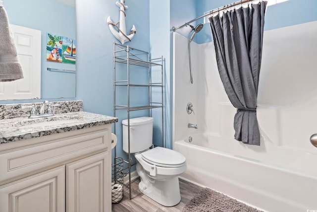 full bathroom with vanity, hardwood / wood-style floors, shower / bath combination with curtain, and toilet