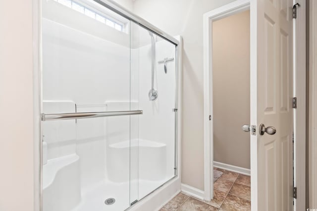 bathroom featuring tile patterned floors and walk in shower