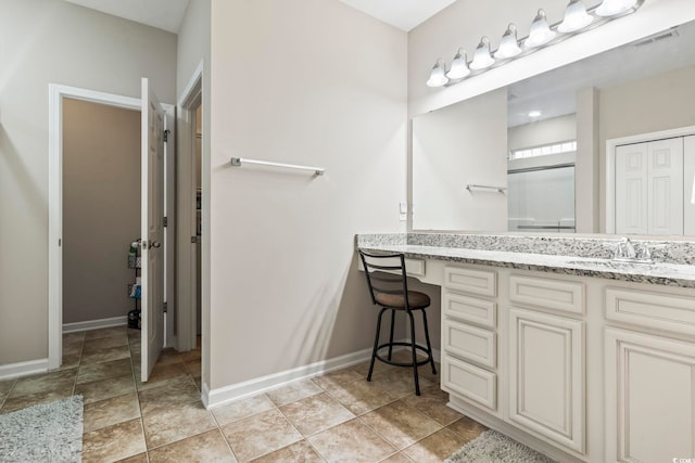 bathroom with vanity and tile patterned floors