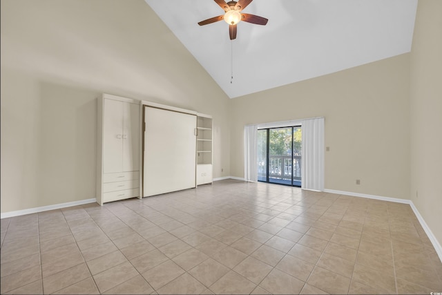 interior space with access to outside, ceiling fan, high vaulted ceiling, and light tile patterned floors