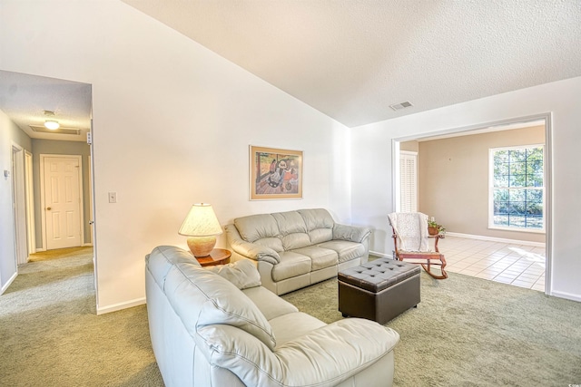 carpeted living room with a textured ceiling and vaulted ceiling