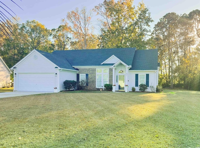 single story home featuring a front lawn and a garage