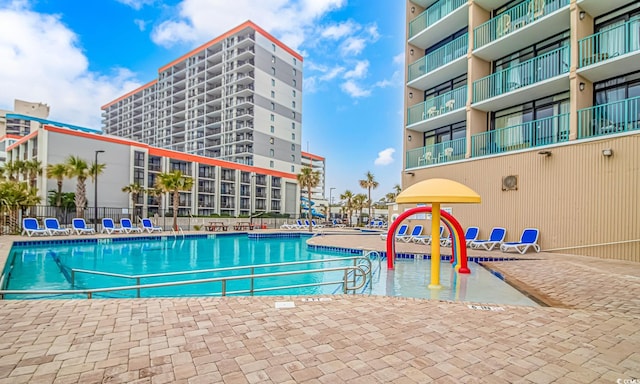 view of swimming pool with fence