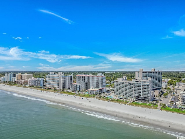 birds eye view of property featuring a view of the beach, a water view, and a view of city