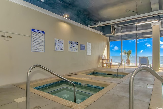 view of swimming pool with an indoor in ground hot tub