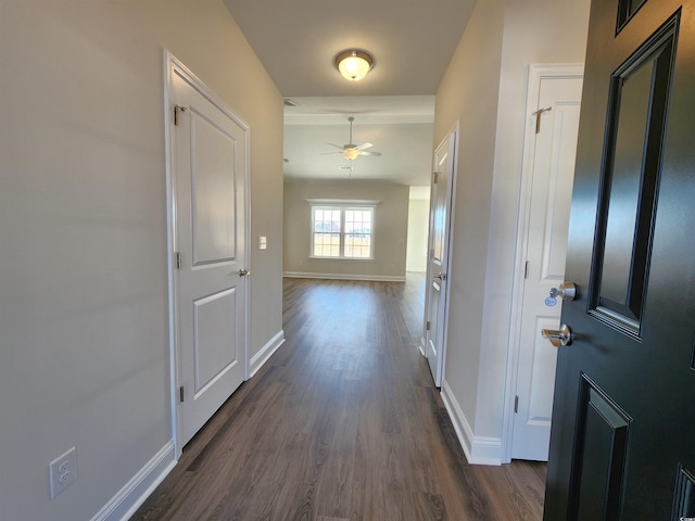 hall with dark wood-type flooring