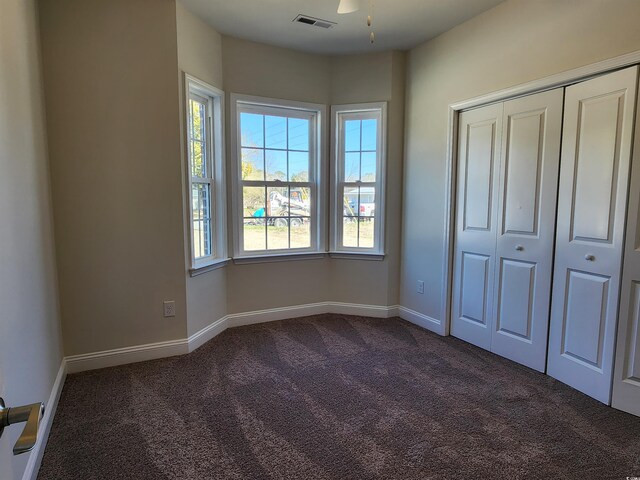 corridor featuring dark wood-type flooring