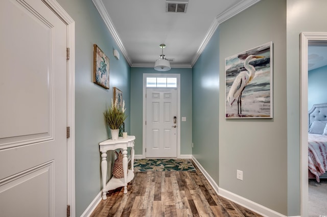 foyer entrance featuring hardwood / wood-style flooring and ornamental molding