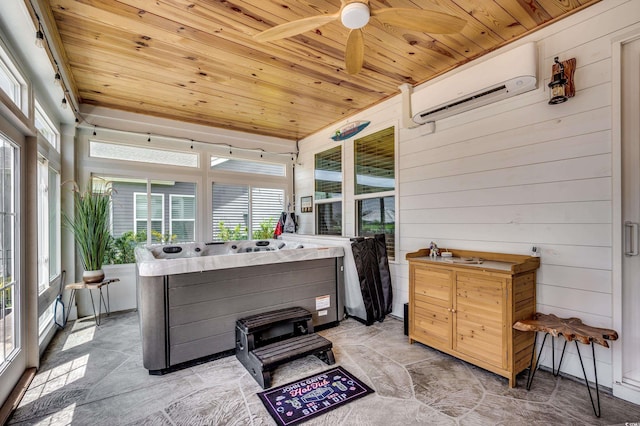 sunroom / solarium with a wall unit AC, ceiling fan, and wooden ceiling