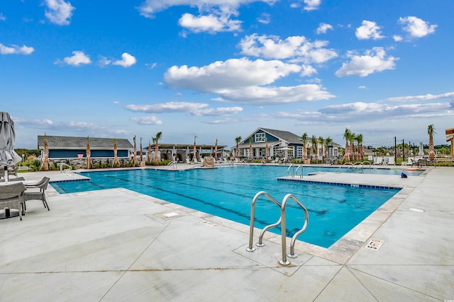 view of swimming pool with a patio area