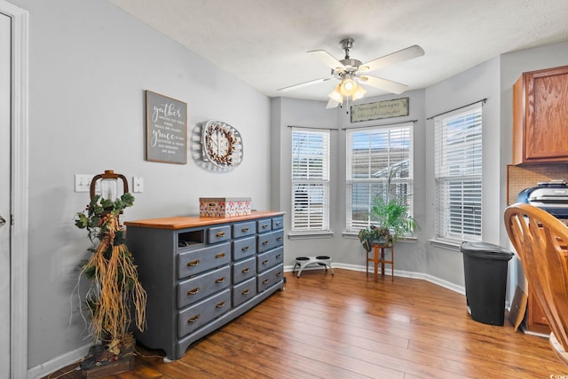 office space with hardwood / wood-style flooring and ceiling fan