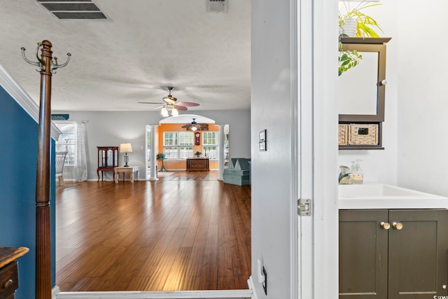 interior space featuring a healthy amount of sunlight, sink, and hardwood / wood-style floors