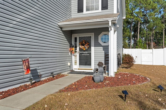 doorway to property featuring a yard