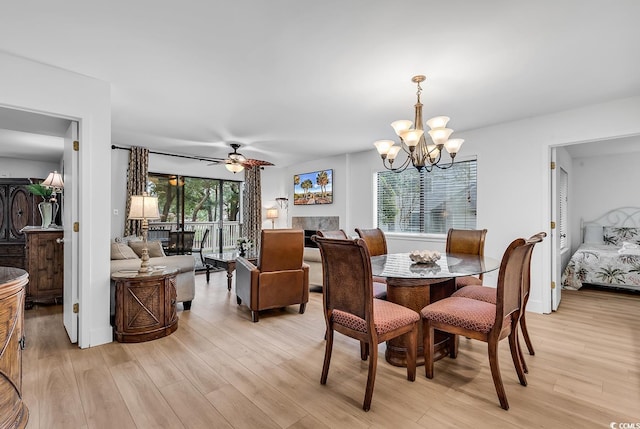 101 Westhill Cir Unit 5-C, Myrtle Beach, SC 29572 - dining space featuring light wood-style floors, a chandelier, and a ceiling fan