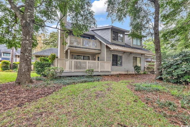 back of property with a balcony