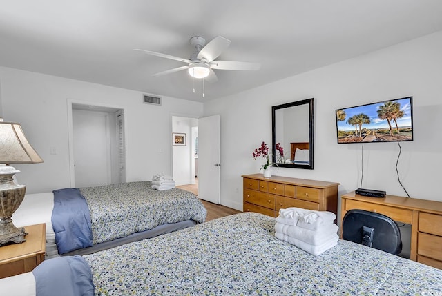 bedroom featuring hardwood / wood-style floors and ceiling fan