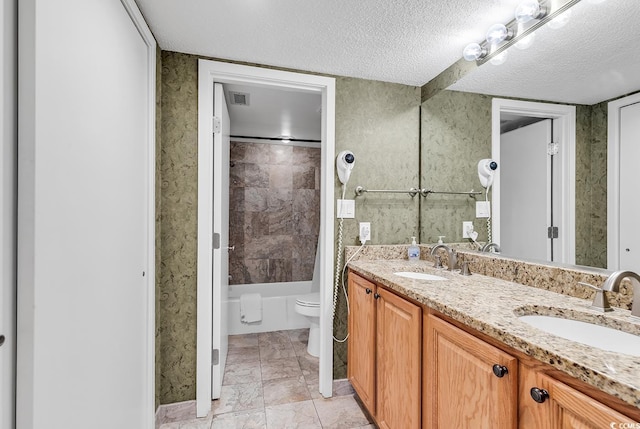 full bathroom with shower / bath combination with curtain, toilet, a textured ceiling, and vanity