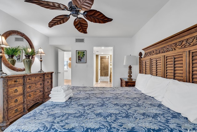 bedroom with ensuite bath and ceiling fan