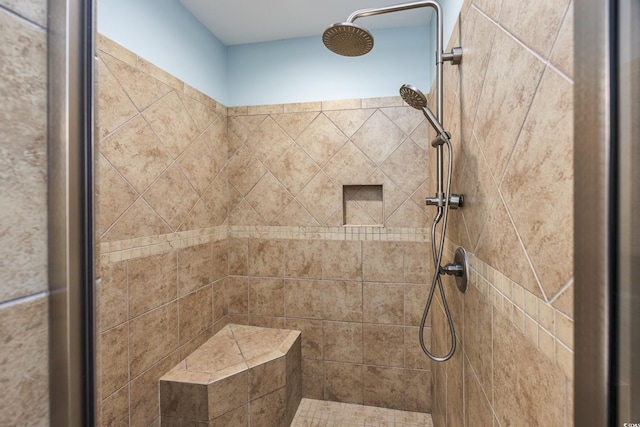 bathroom with tiled shower