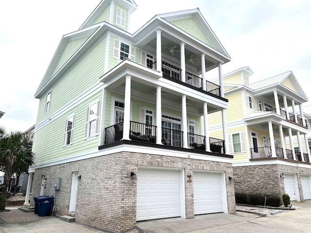 exterior space featuring a garage and a balcony