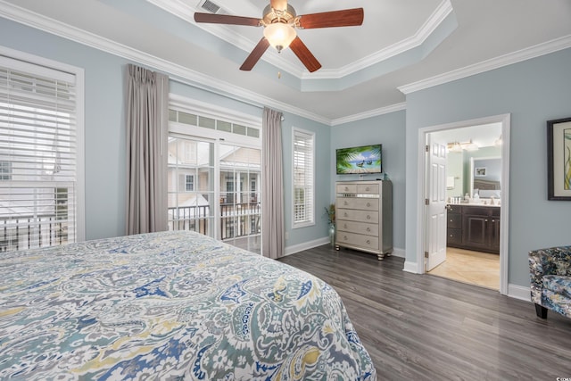 bedroom featuring ensuite bathroom, dark hardwood / wood-style floors, ceiling fan, a raised ceiling, and crown molding