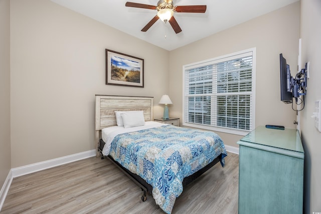 bedroom featuring wood-type flooring and ceiling fan