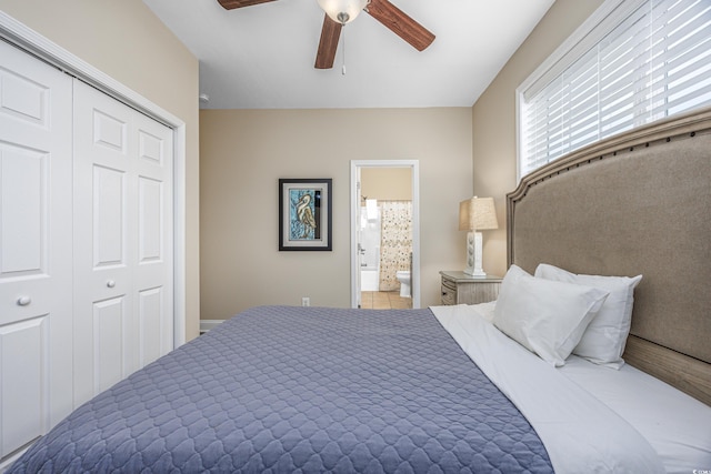 bedroom featuring ensuite bath, a closet, and ceiling fan