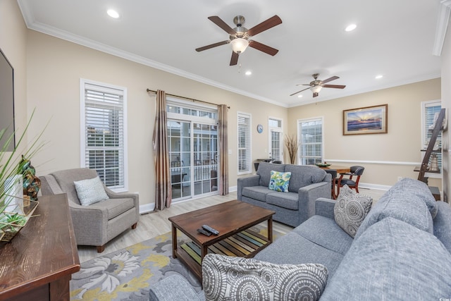 living room featuring crown molding, light hardwood / wood-style floors, and ceiling fan