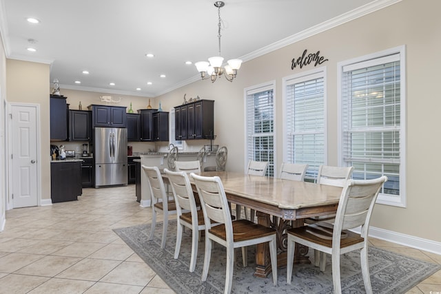 dining space with an inviting chandelier, light tile patterned floors, and ornamental molding