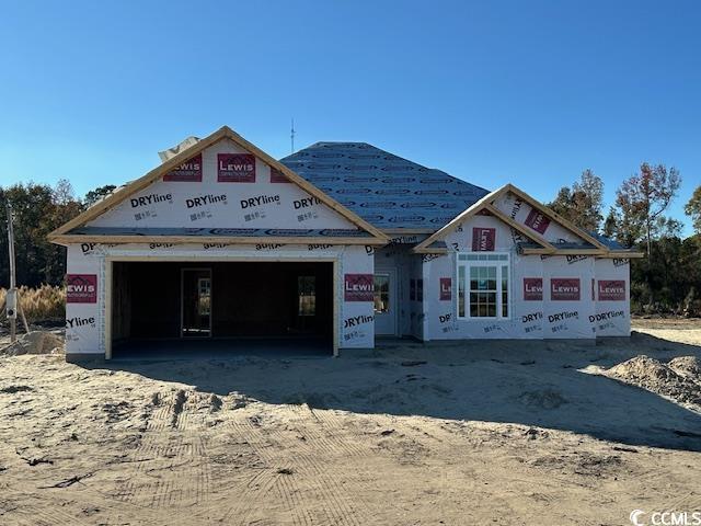 property in mid-construction with a garage