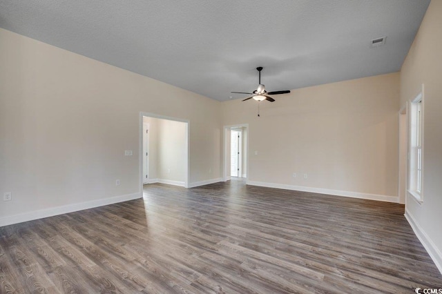 unfurnished living room with a textured ceiling, hardwood / wood-style flooring, and ceiling fan