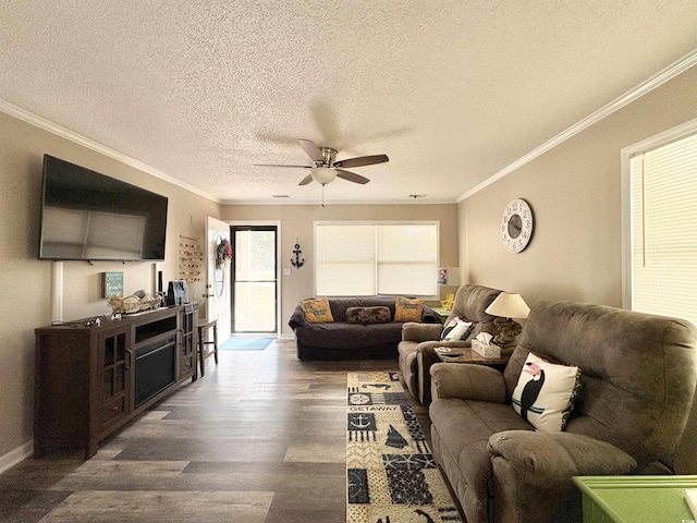 living room with a textured ceiling, dark hardwood / wood-style floors, ceiling fan, and crown molding