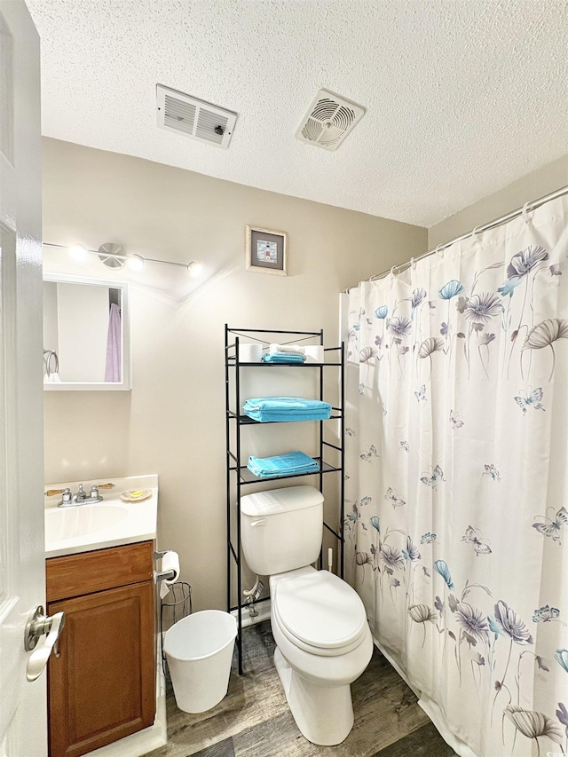 100 Dorman Cir, Myrtle Beach, SC 29577 - bathroom with wood finished floors, toilet, vanity, a textured ceiling, and a shower with curtain