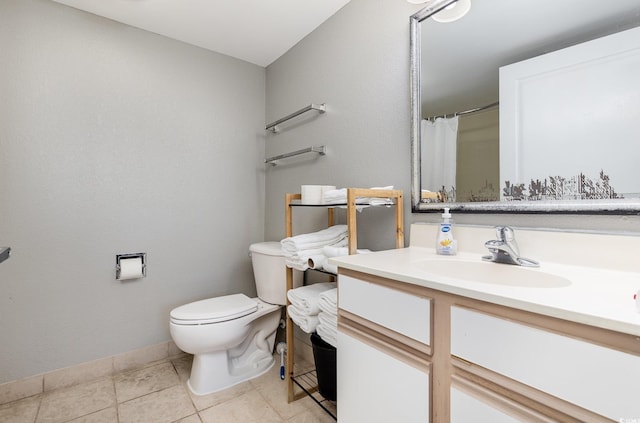 bathroom featuring tile patterned floors, vanity, a shower with shower curtain, and toilet