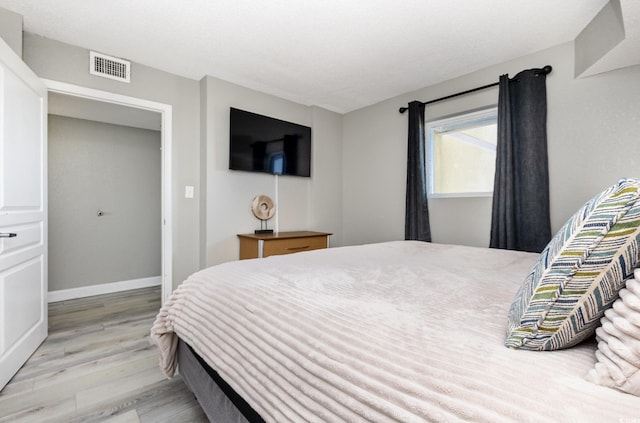 2701 S Ocean Blvd Unit 1808, North Myrtle Beach, SC 29582 - bedroom with light wood finished floors and baseboards