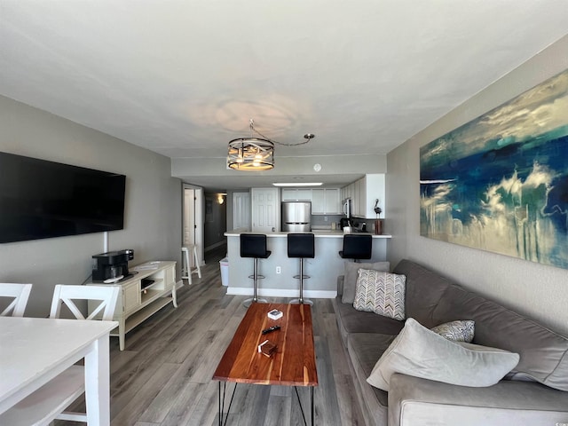 2701 S Ocean Blvd Unit 1808, North Myrtle Beach, SC 29582 - living area featuring light wood-style floors and a chandelier