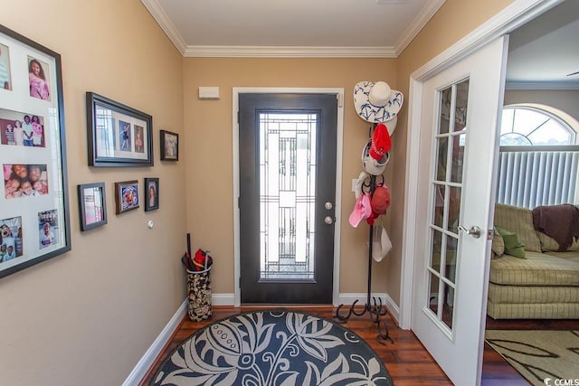 foyer with french doors, dark hardwood / wood-style flooring, plenty of natural light, and ornamental molding