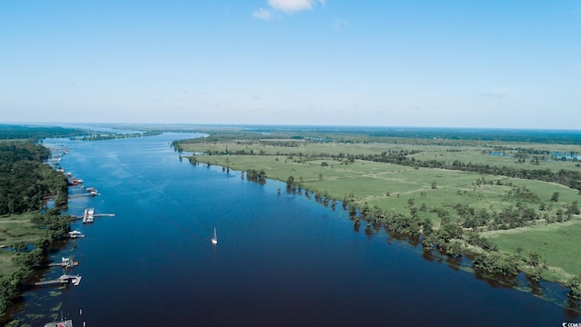 bird's eye view with a rural view and a water view