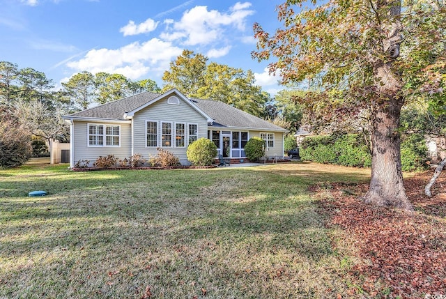 ranch-style house with a front lawn