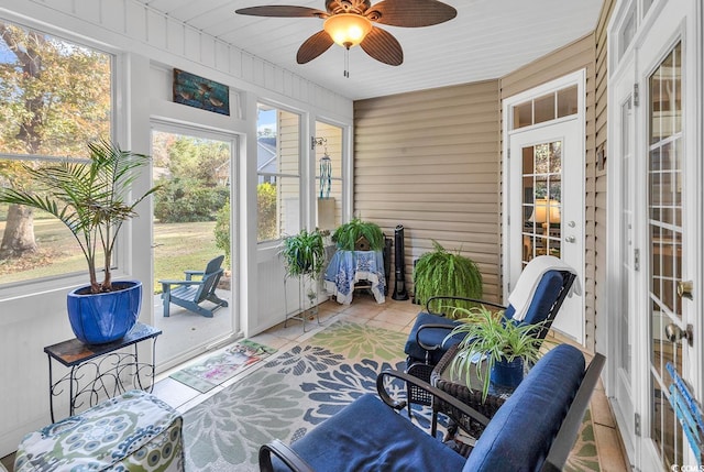 sunroom / solarium featuring ceiling fan and a wealth of natural light