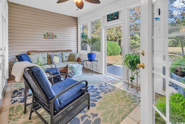 sunroom with ceiling fan