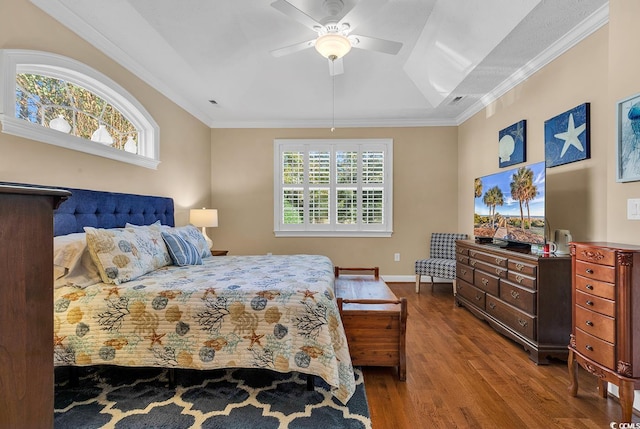 bedroom with multiple windows, ceiling fan, hardwood / wood-style floors, and crown molding