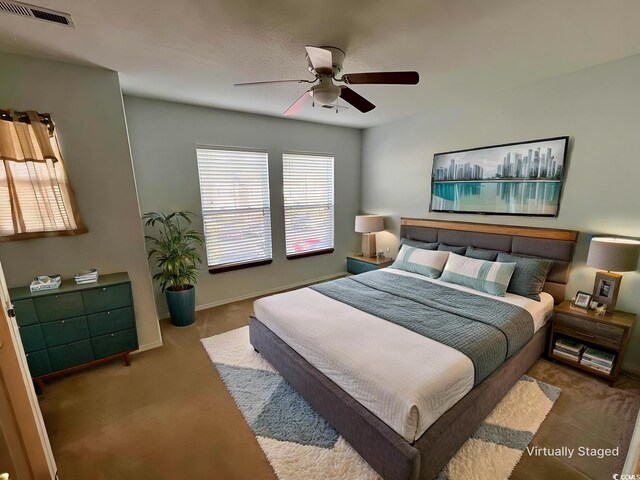 carpeted bedroom featuring ceiling fan