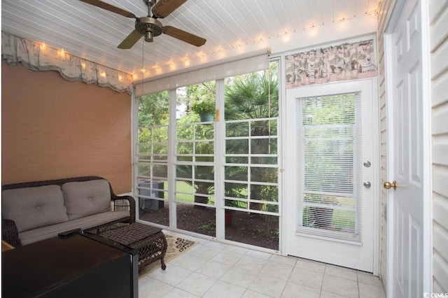 sunroom / solarium with a wealth of natural light and ceiling fan